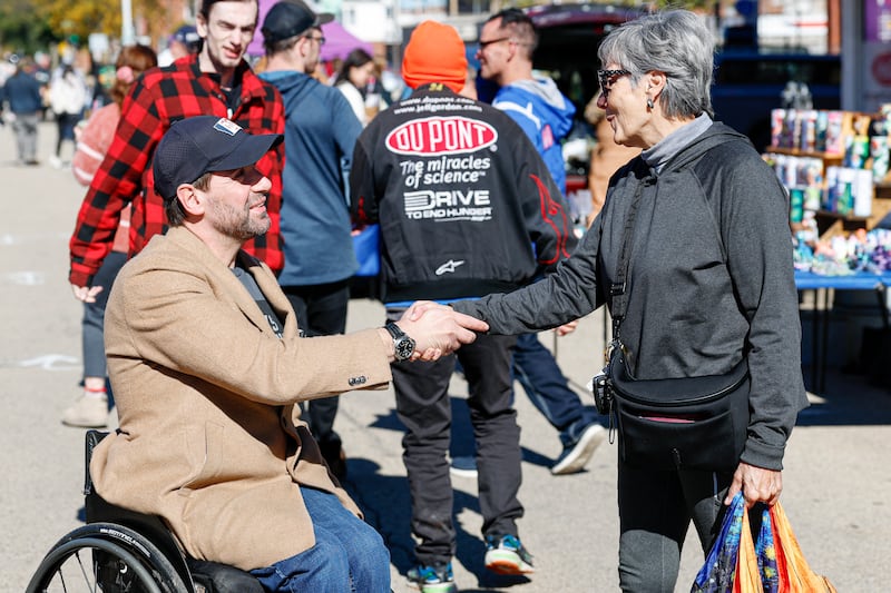 Democratic US Senate candidate Josh Turek  speaks to a supporter during a campaign stop at the Dubuque Farmers' Market in Dubuque, Iowa. Photograph: Kamil Krzaczynski/AFP/Getty