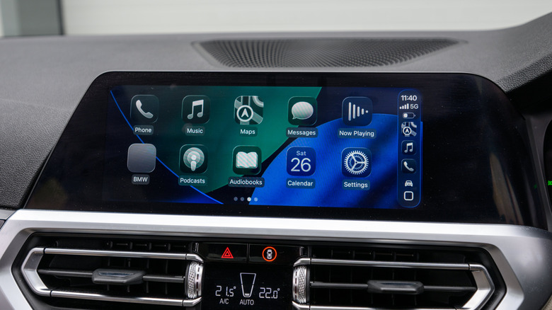 A car's infotainment system showing the Apple CarPlay app layout.