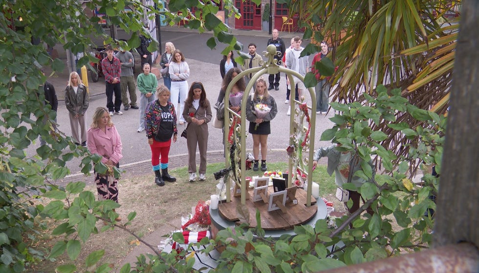 embargo 30092025 the villagers gather for a vigil in hollyoaks