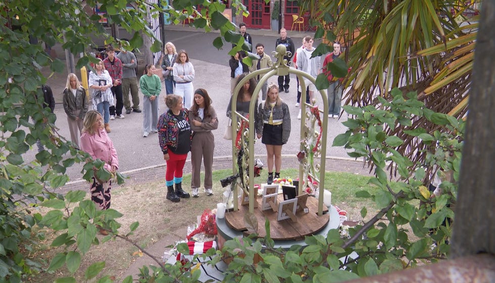 embargo 30092025 the villagers gather for a vigil in hollyoaks