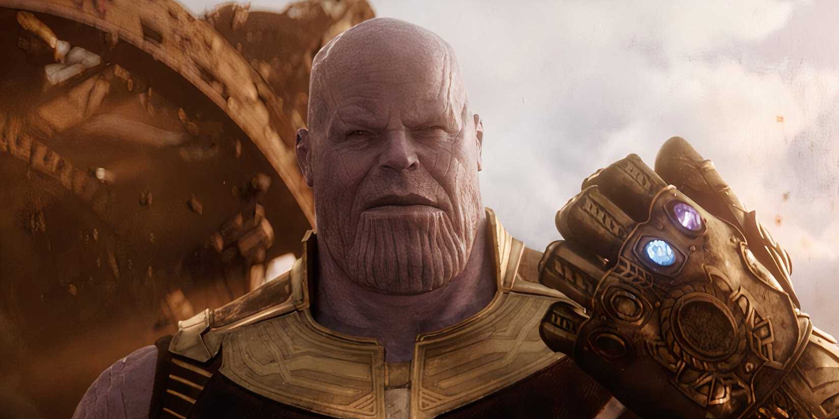Josh Brolin's Thanos holding up the infinity gauntlet in Avengers: Infinity War.