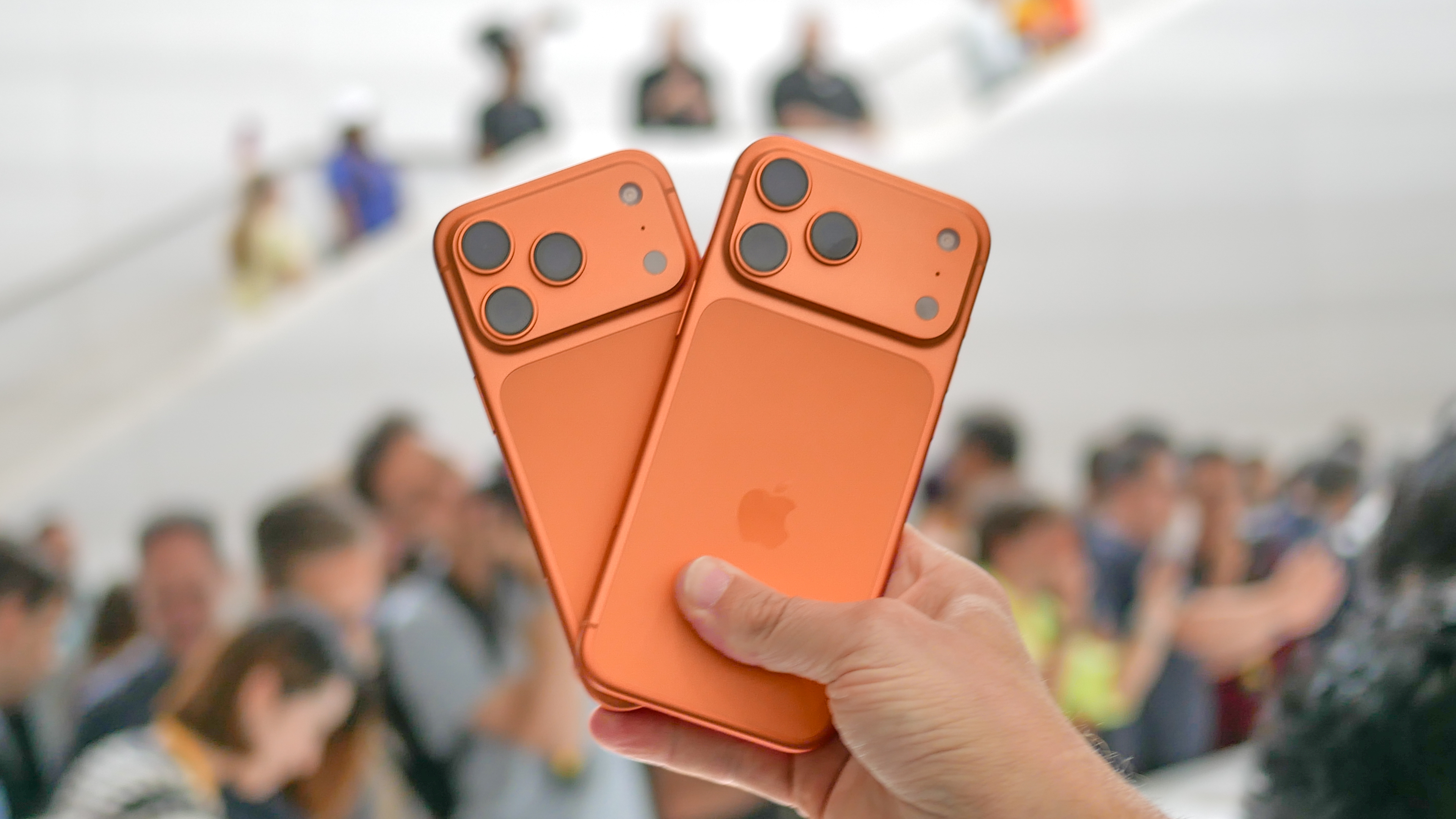 iPhone 17 Pro and Pro Max held in the hand.