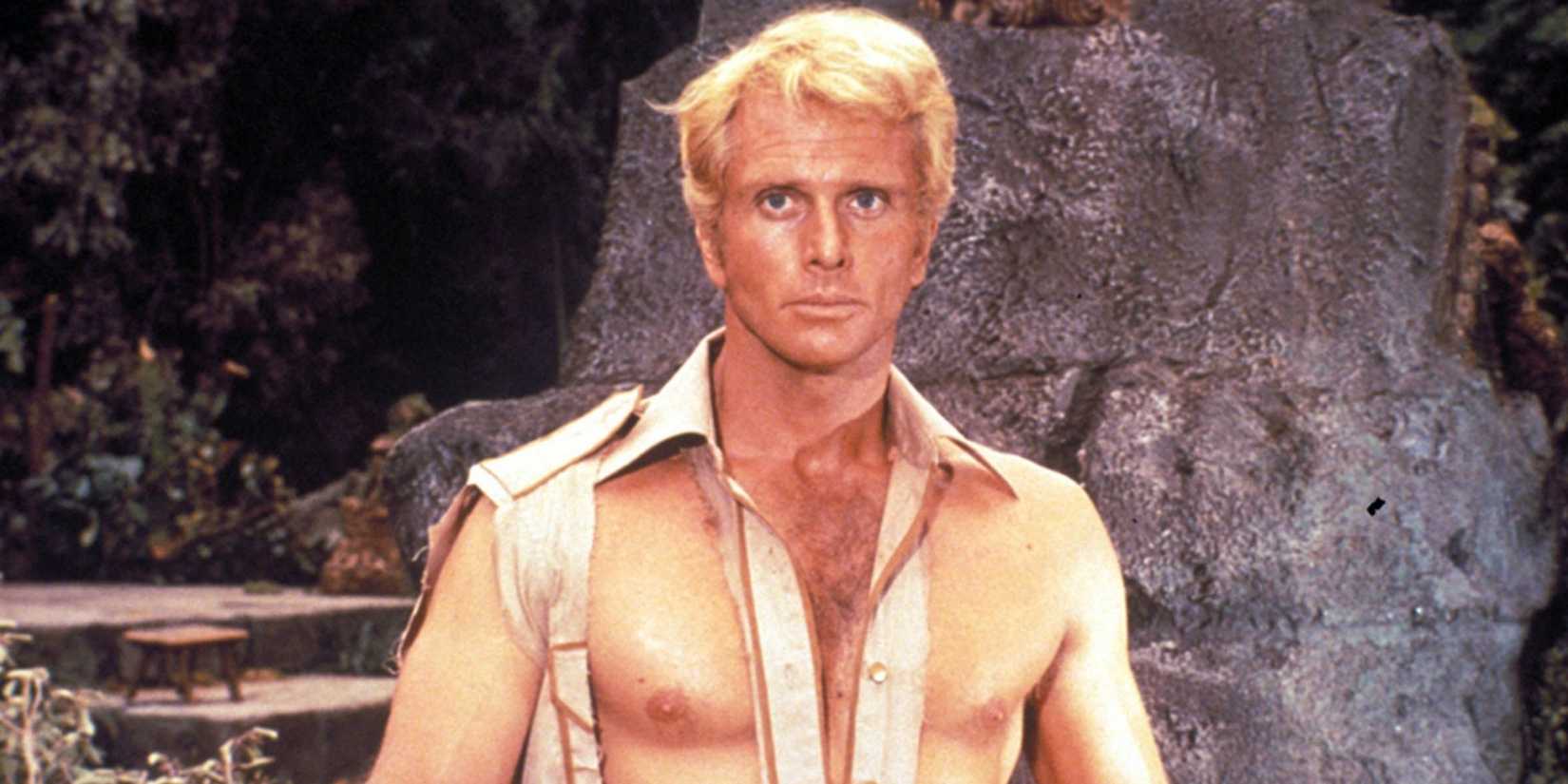 Ron Ely as Doc Savage with a ripped shirt