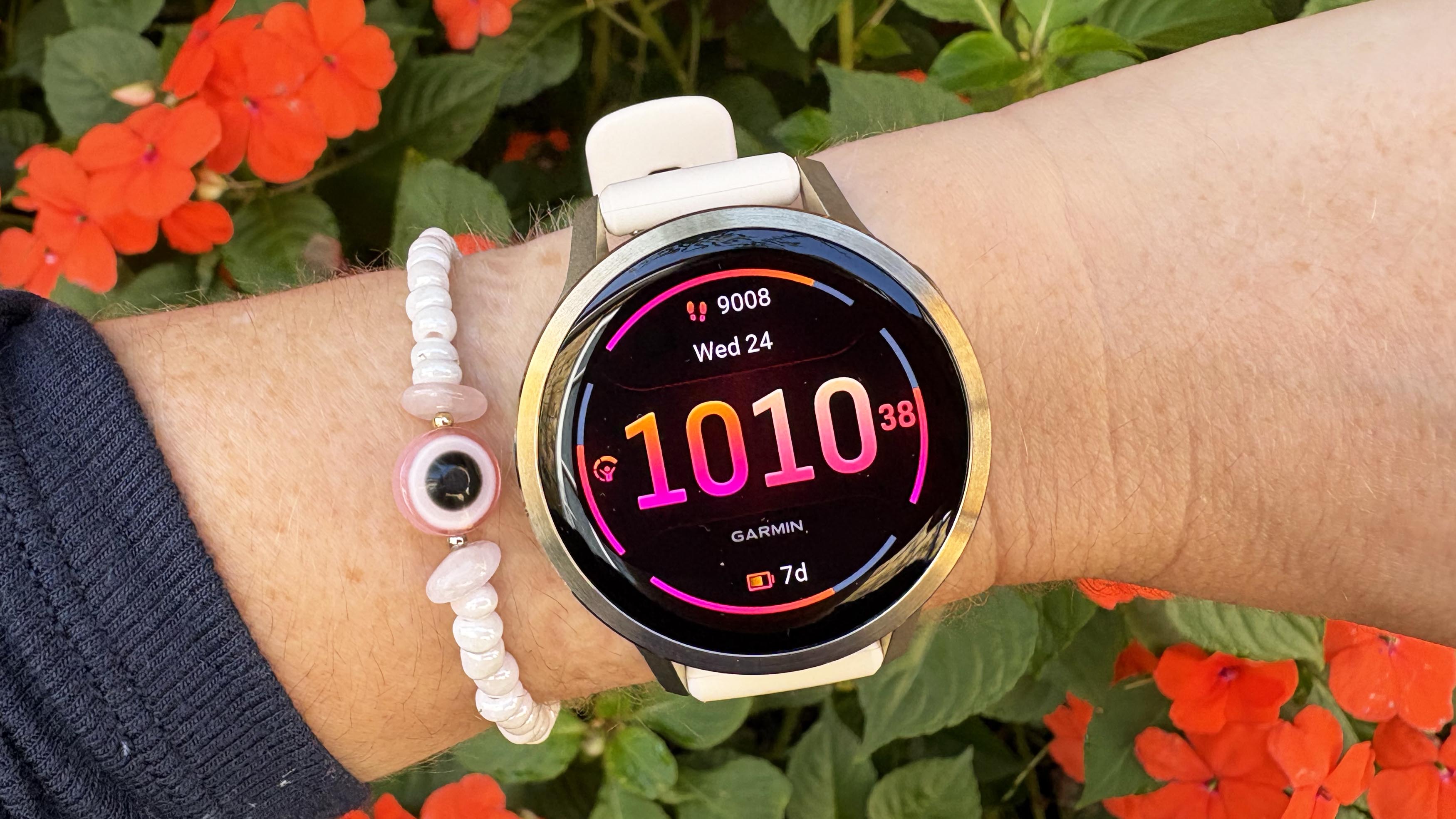 the Garmin Venu 4 in lunar gold on the wrist