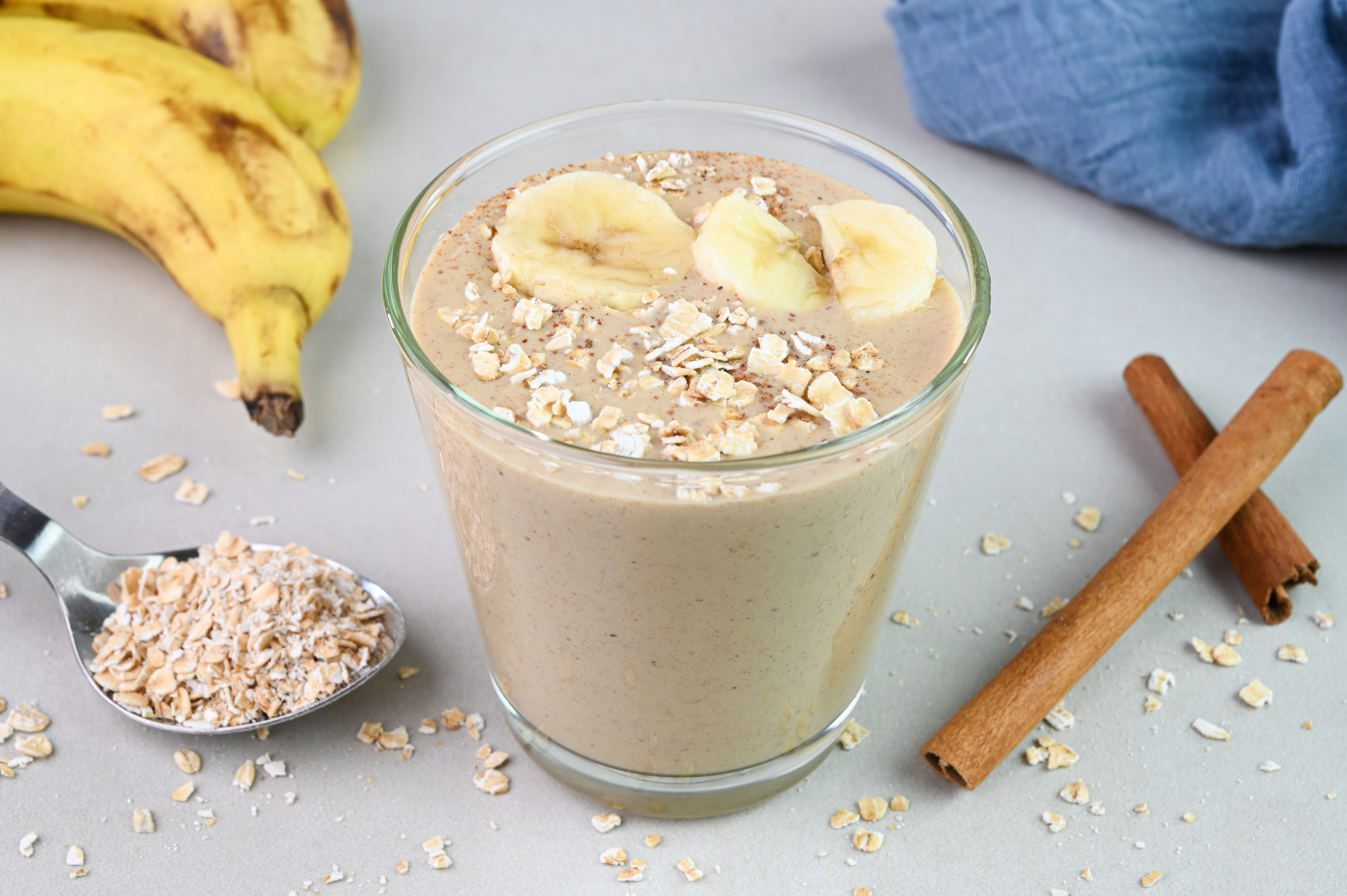 Banana oatmeal smoothie in a cup.