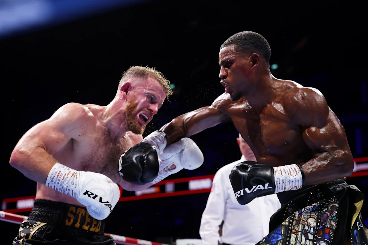 LONDON, ENGLAND - OCTOBER 25: Ezra Taylor punches Steed Woodall during the British and Commonwealth Light Heavyweight Title fight between Ezra Taylor and Steed Woodall on the 