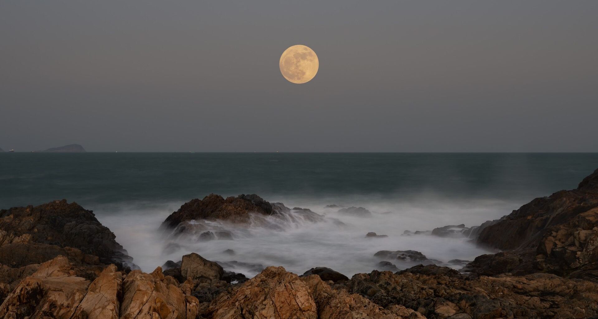 the moon over the ocean