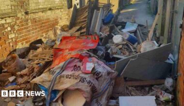 A large amount of construction waste dumping in a small street.