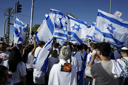 People celebrate as released hostage Segev Kalfon returns home, Dimona, southern Israel, Sunday.