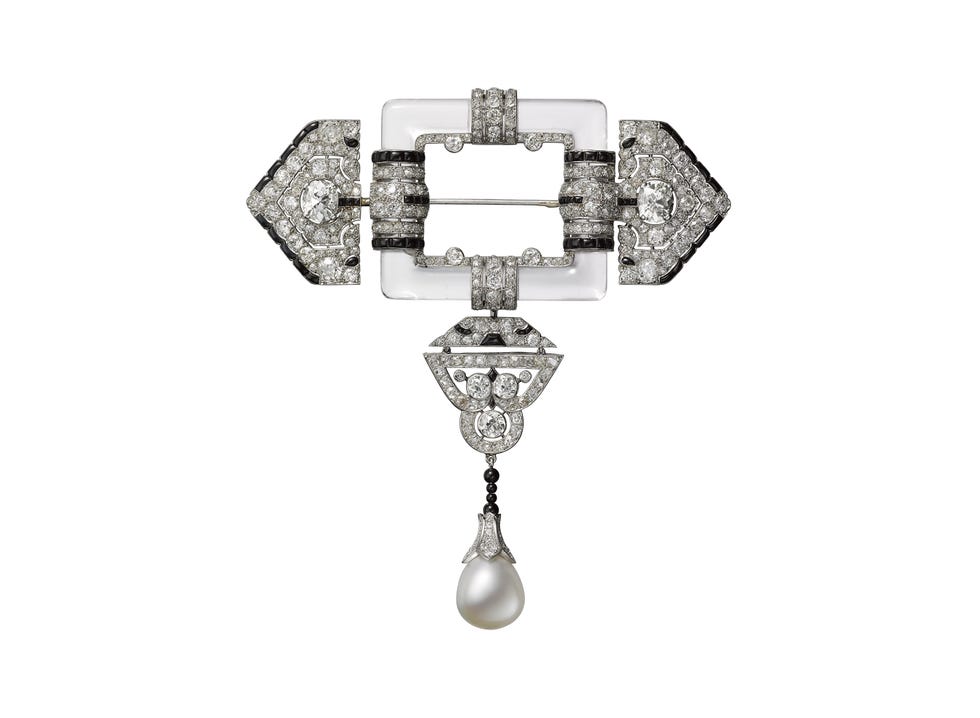 Art Deco style brooch featuring diamonds, black onyx, and a pearl.