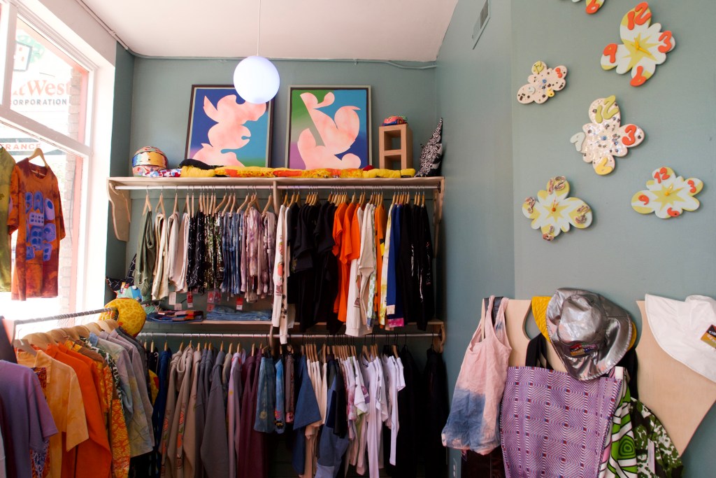 A rack of colorful apparel at Time Change Generator.