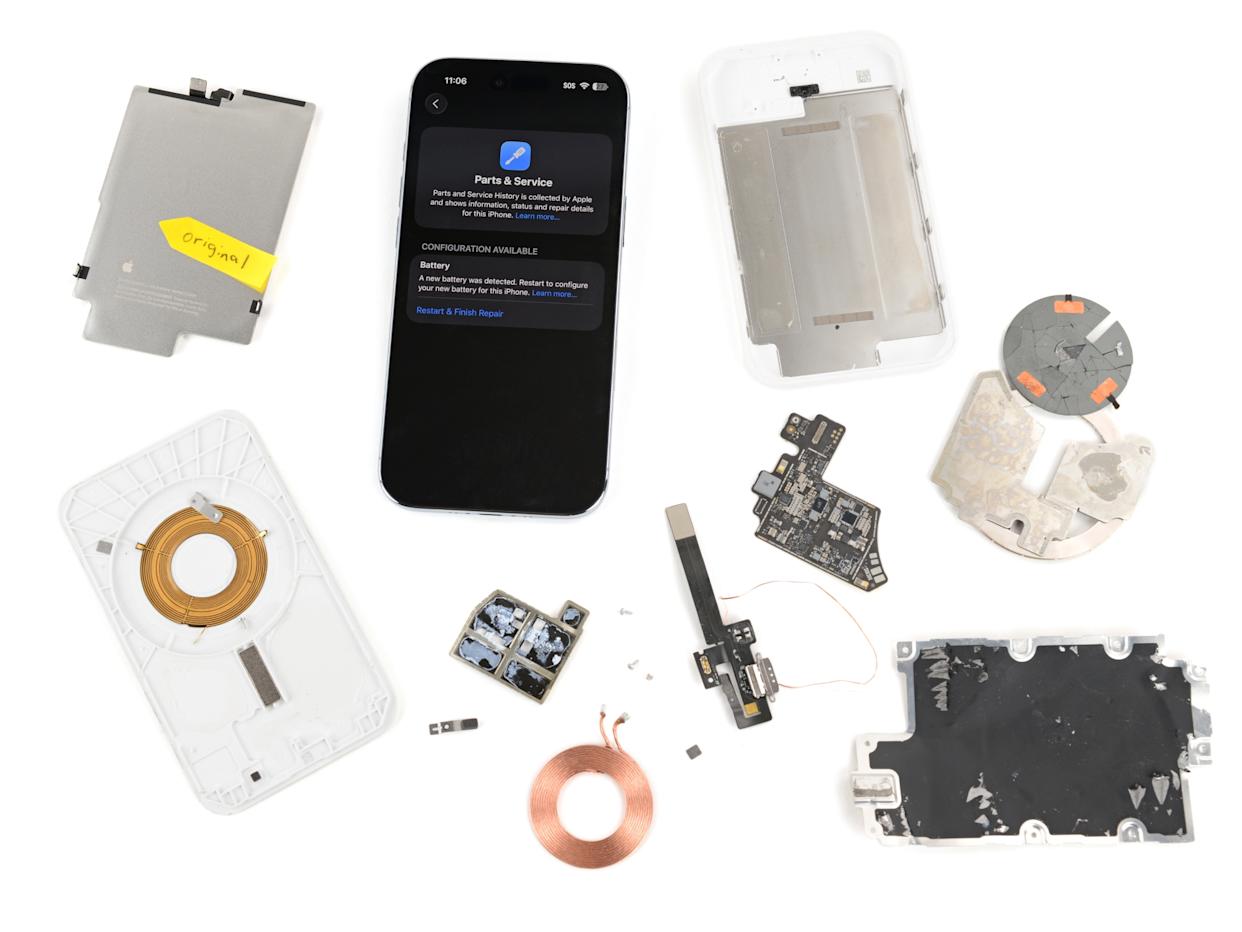 iPhone with Parts & Service screen among disassembled components, including a battery labeled original.