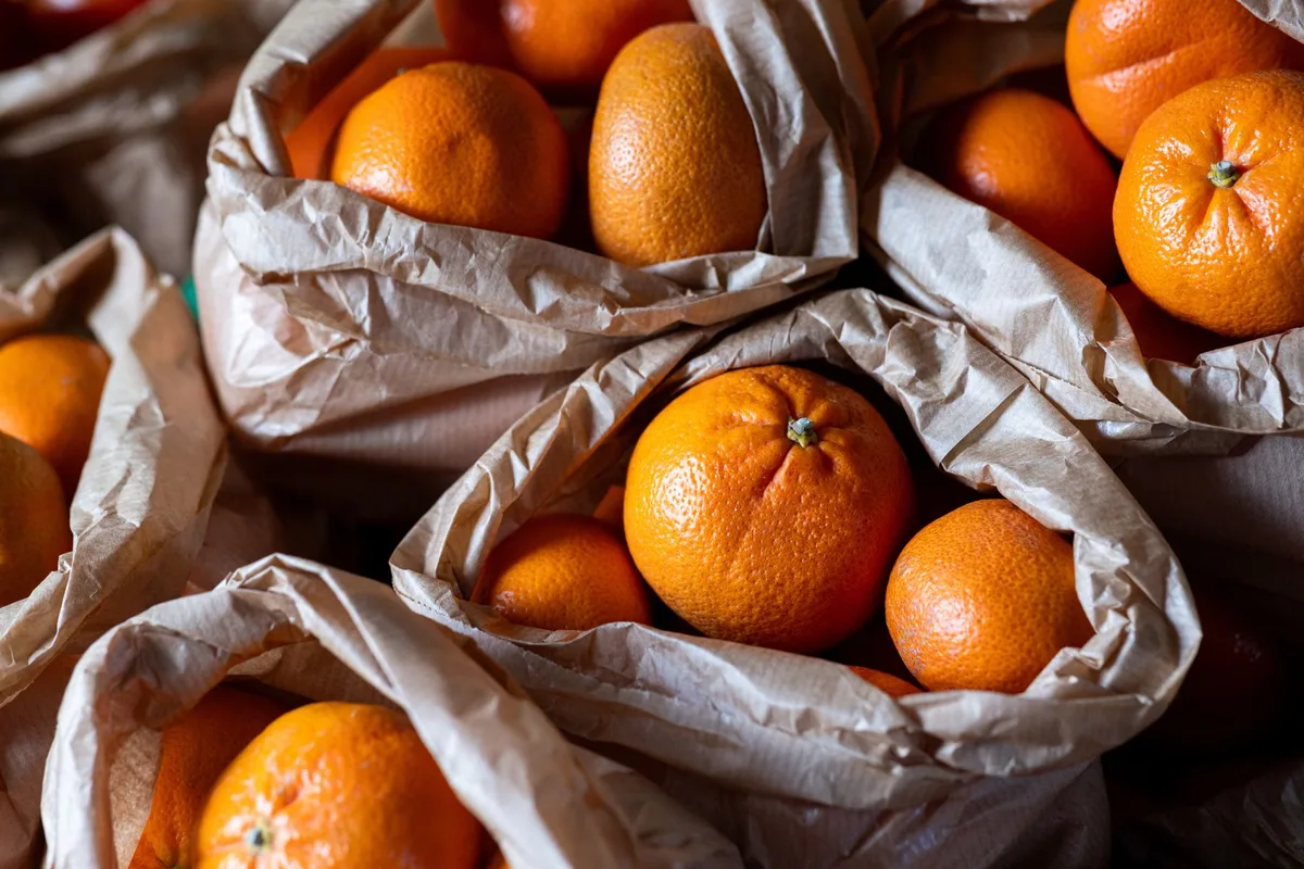 Oranges in paper bags