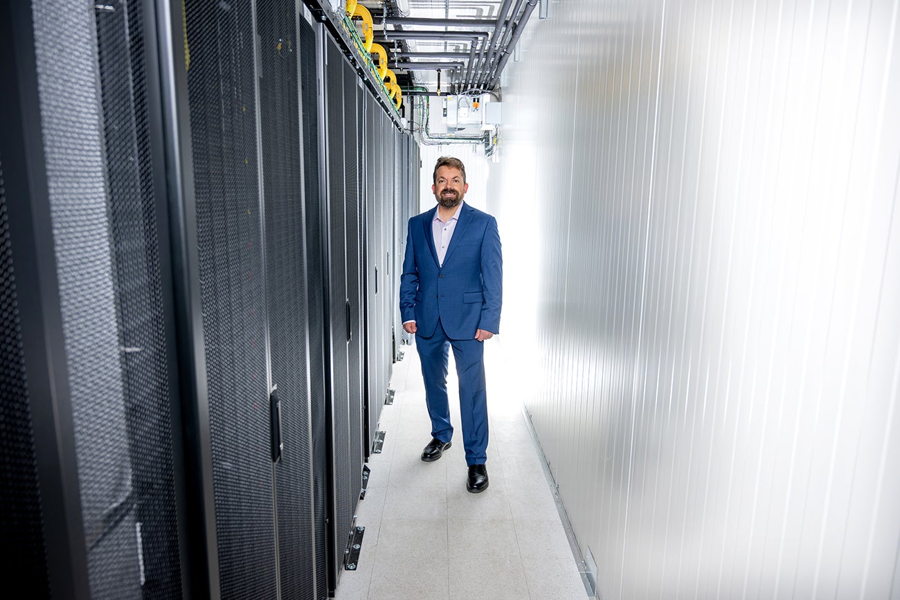 Ira Burton posing with computer racks