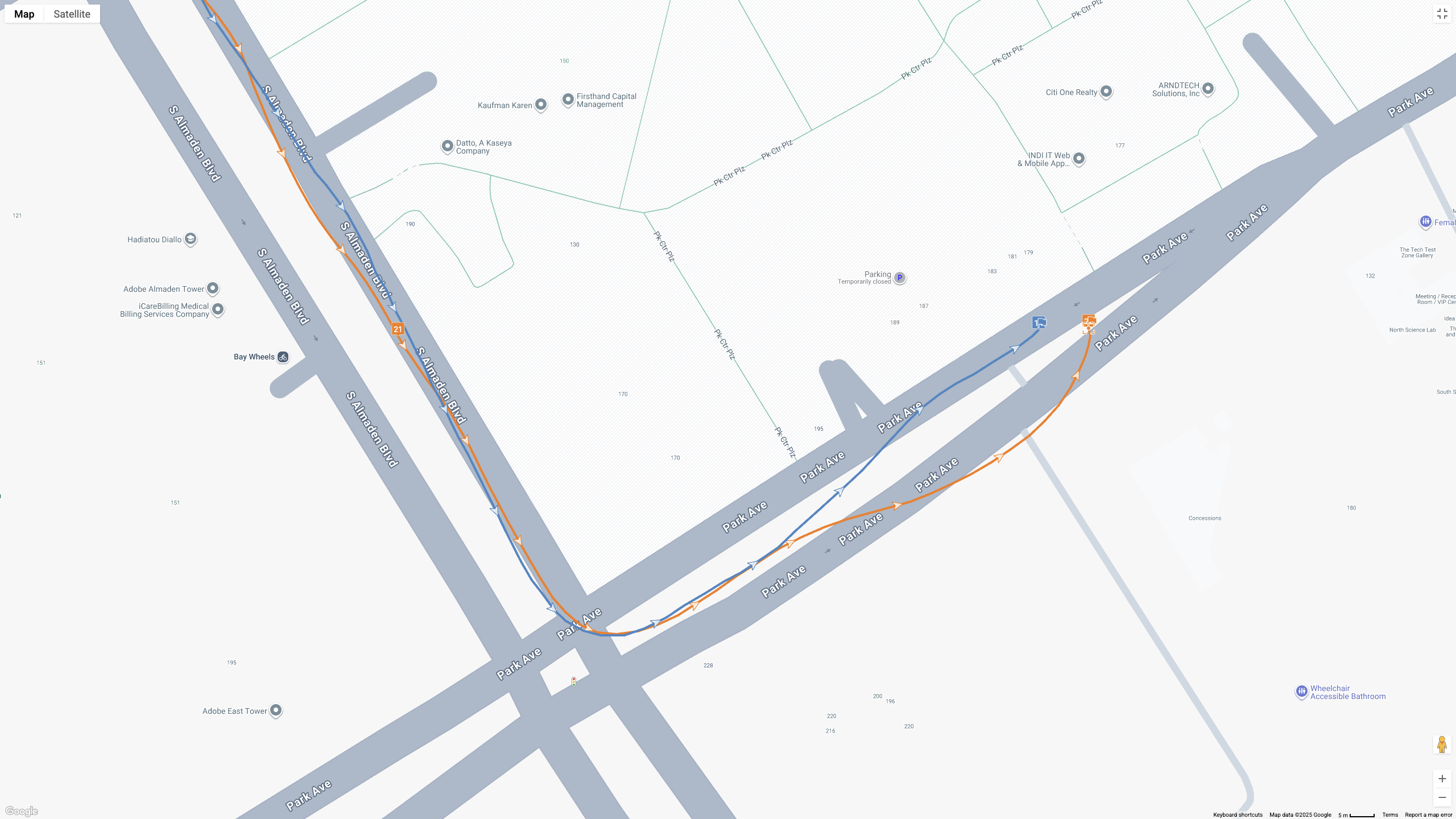 A GPS map showing how the Garmin Forerunner 970 (blue line) and Google Pixel Watch 4 (orange line) compare for a half-marathon test.