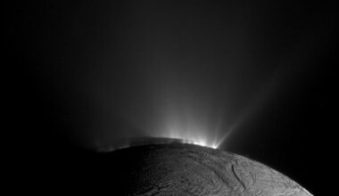Enceladus with a glow from the Sun highlighting its jets. Credit - NASA / JPL-Caltech / SSI