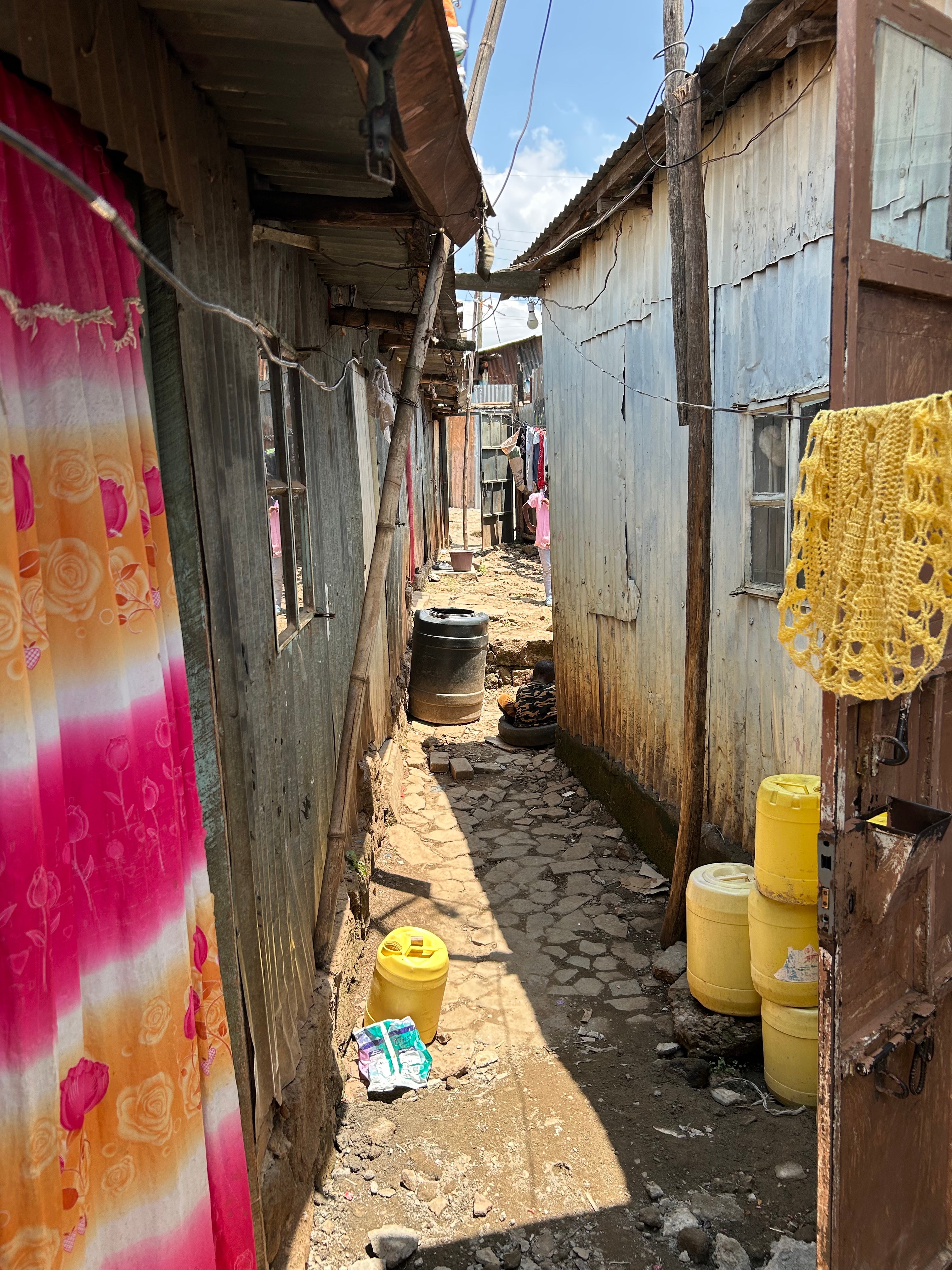 The 2024 floods filled Consolata’s house and yard, pictured, with floodwaters, forcing her and her family from their home for a month and preventing her from being able to work