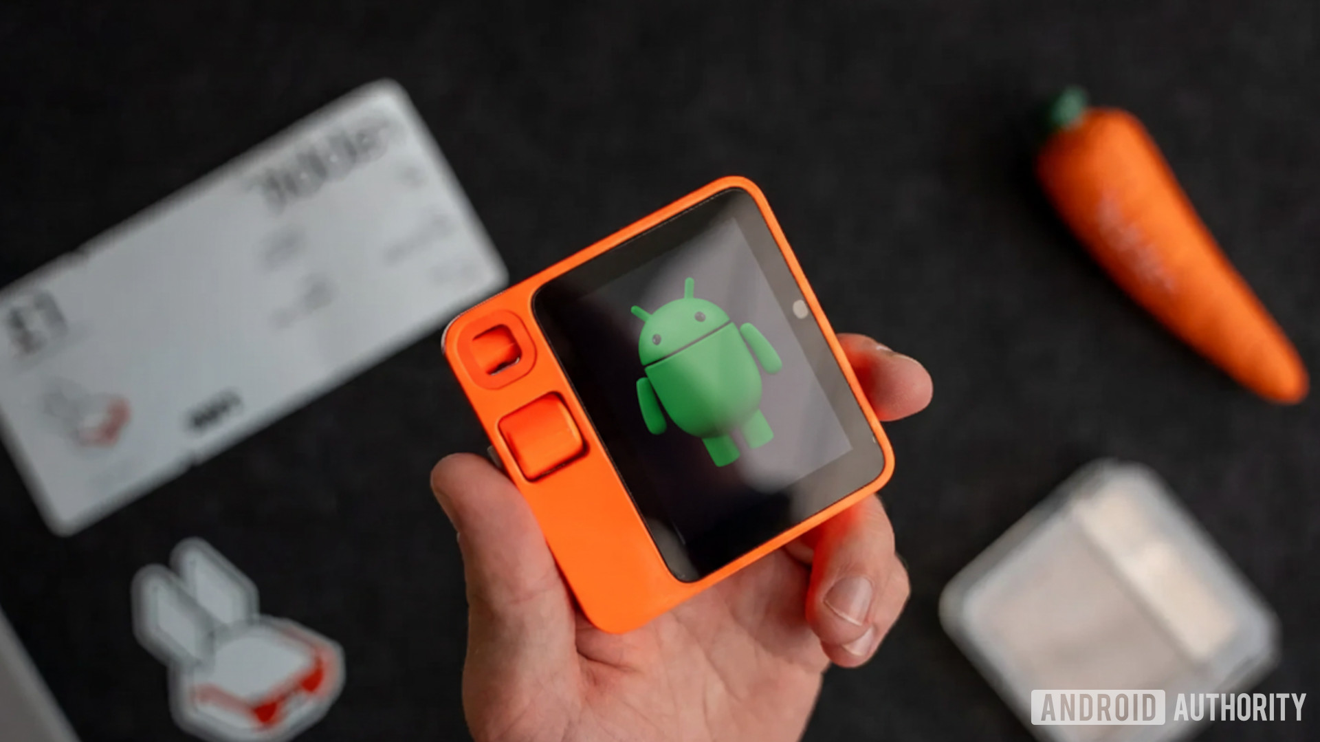 Image of the Android Bot mascot on the Rabbit R1