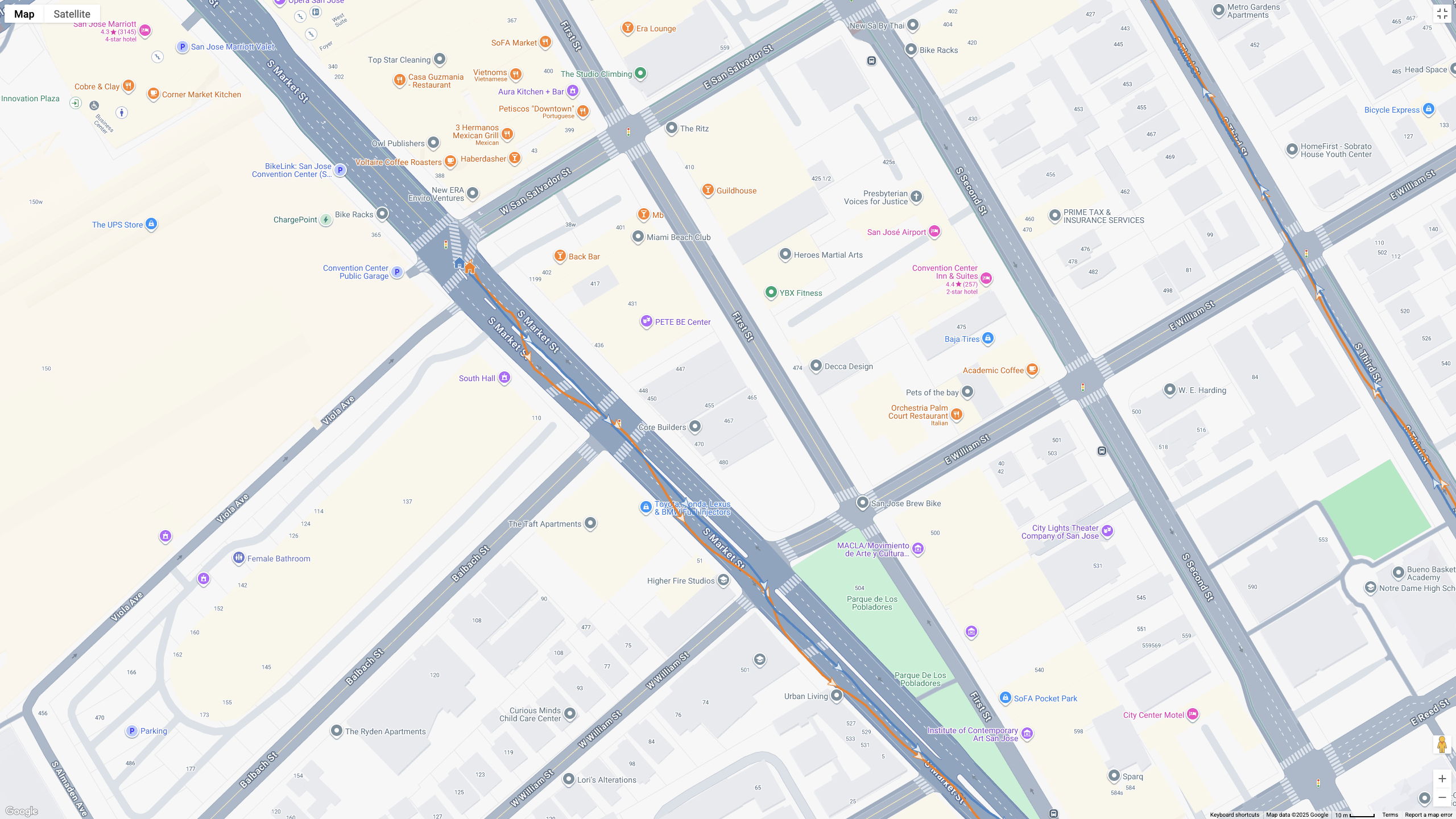A GPS map showing how the Garmin Forerunner 970 (blue line) and Google Pixel Watch 4 (orange line) compare for a half-marathon test.