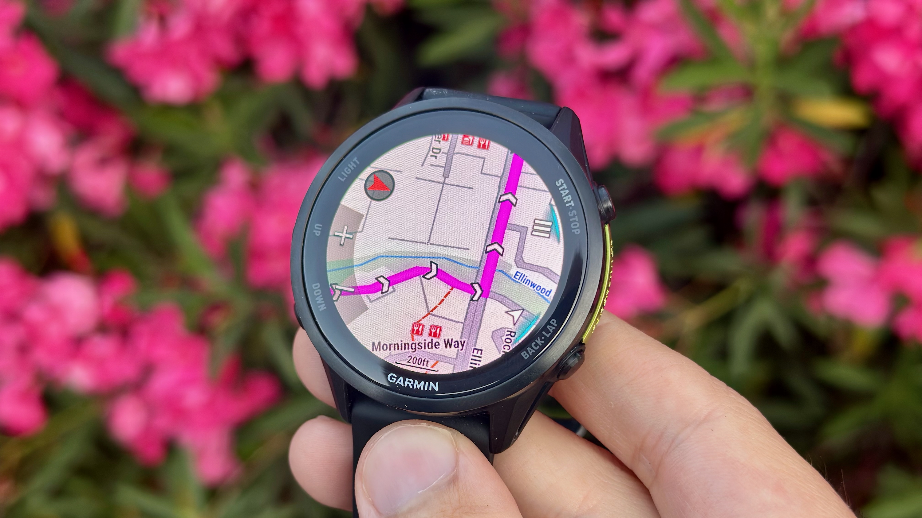 The Garmin Forerunner 970 showing a course route on a detailed city map.