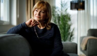 Middle-aged Caucasian woman deep in thought while looking out of the window