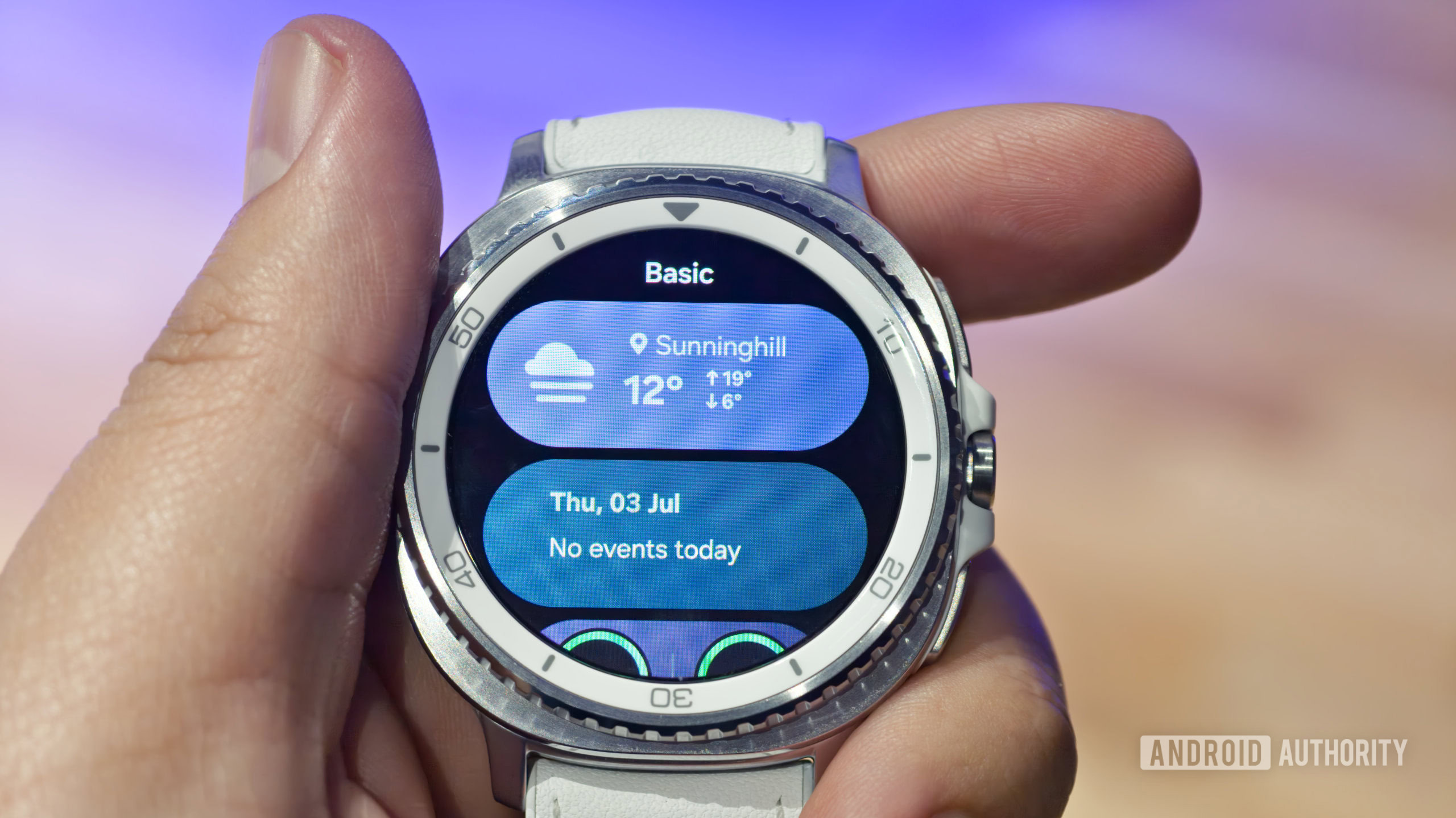 Samsung Galaxy Watch 8 Classic in hand showing weather