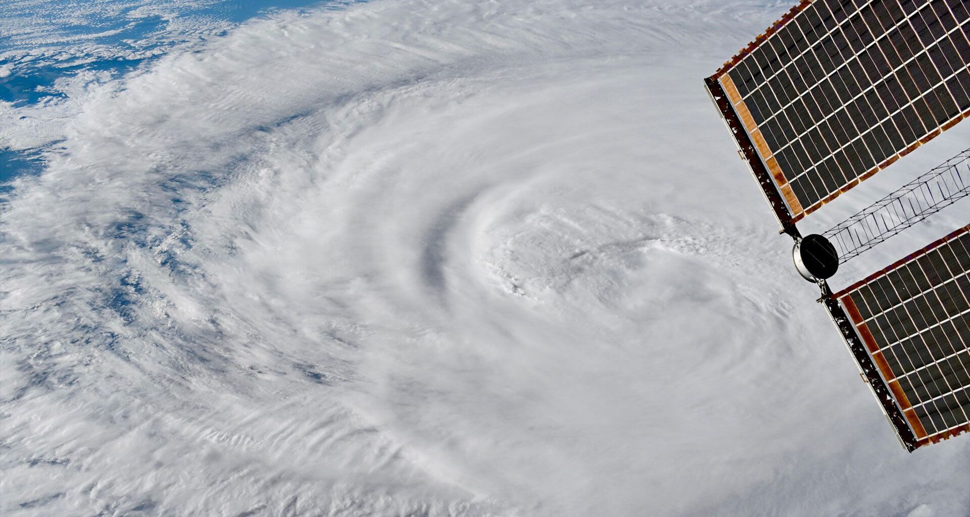 a radial white cloud formation as viewed from above Earth