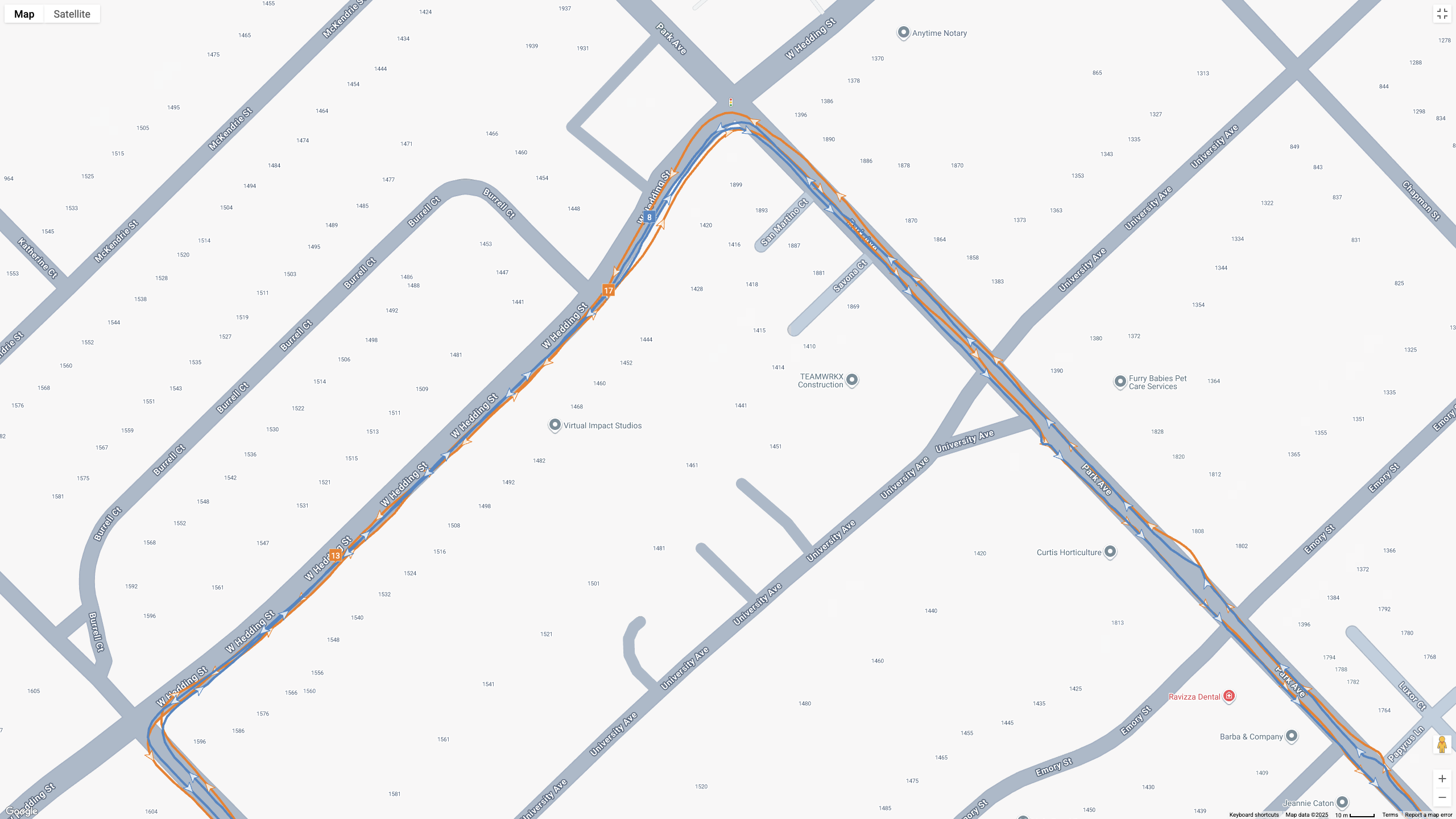 A GPS map showing how the Garmin Forerunner 970 (blue line) and Google Pixel Watch 4 (orange line) compare for a half-marathon test.