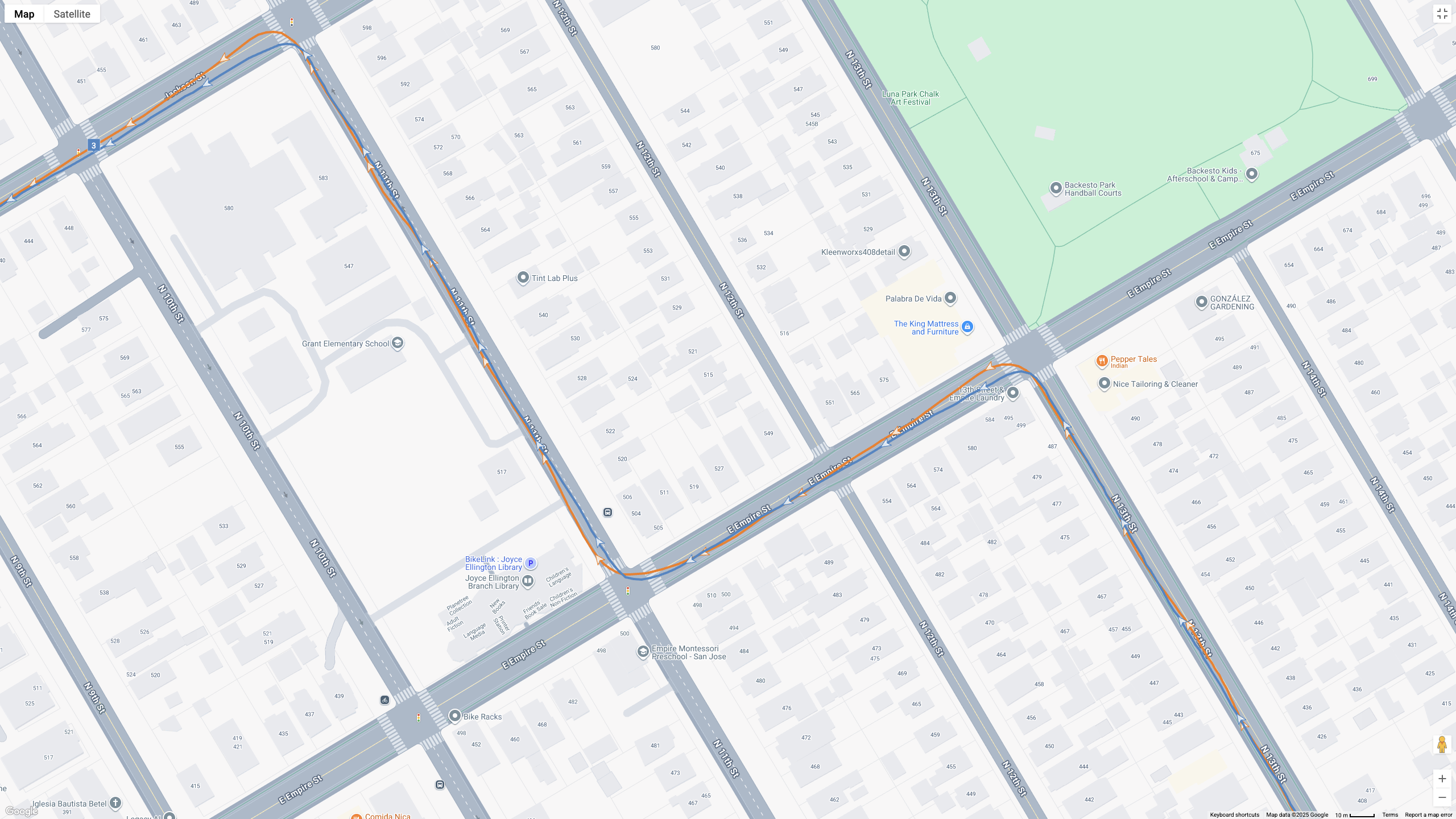 A GPS map showing how the Garmin Forerunner 970 (blue line) and Google Pixel Watch 4 (orange line) compare for a half-marathon test.