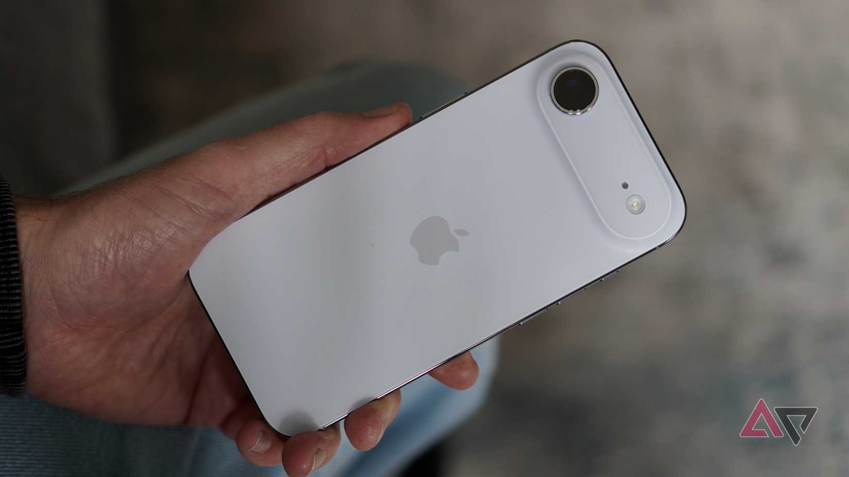 A person holding the Apple iPhone Air