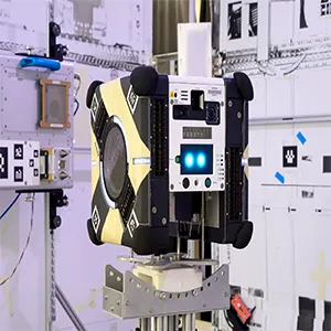 Astrobee Honey flight unit and docking unit in the Automated Science Research Facility at Ames. Credit: NASA/Dominic Hart