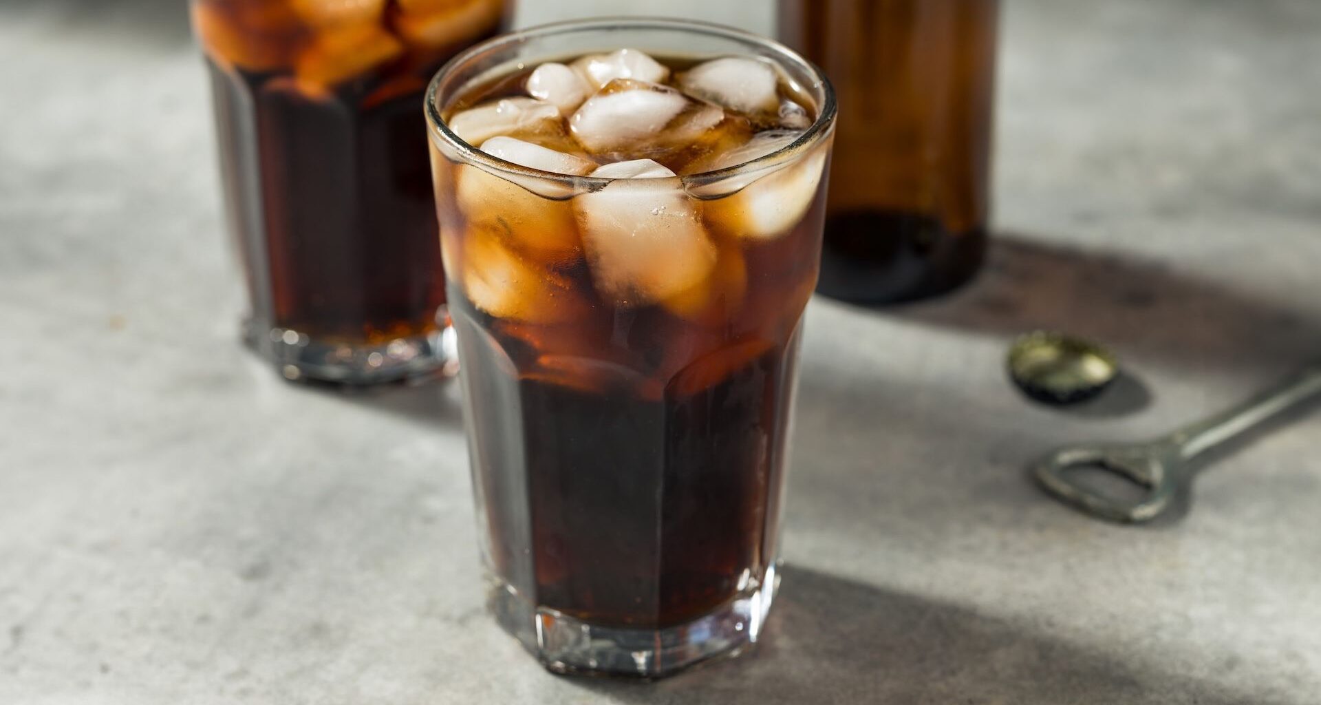 glasses of brown soda on a table