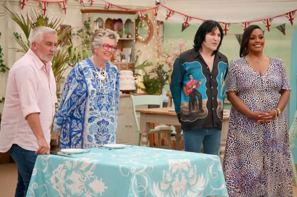 Great British Bake Off 2025 Dessert Week, Paul, Prue, Noel and Alison great british bake off 2025 dessert week, left o right paul hollywood, prue leith, noel fielding and alison hammond stood in a row in the tent