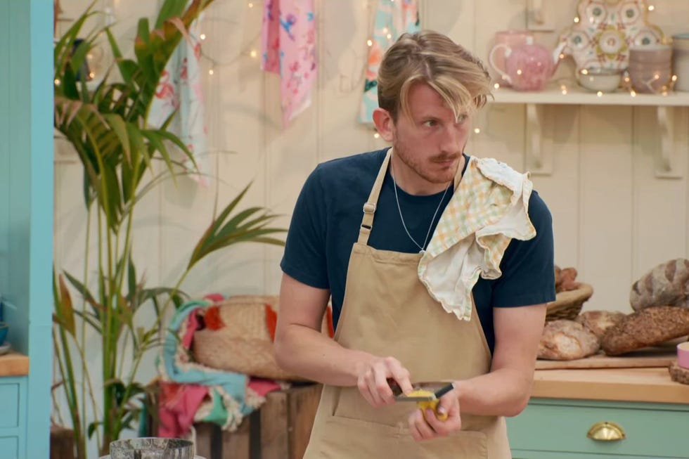 Great British Bake Off 2025 Dessert Week, Tom great british bake off 2025 dessert week, tom looking up as he grates an orange