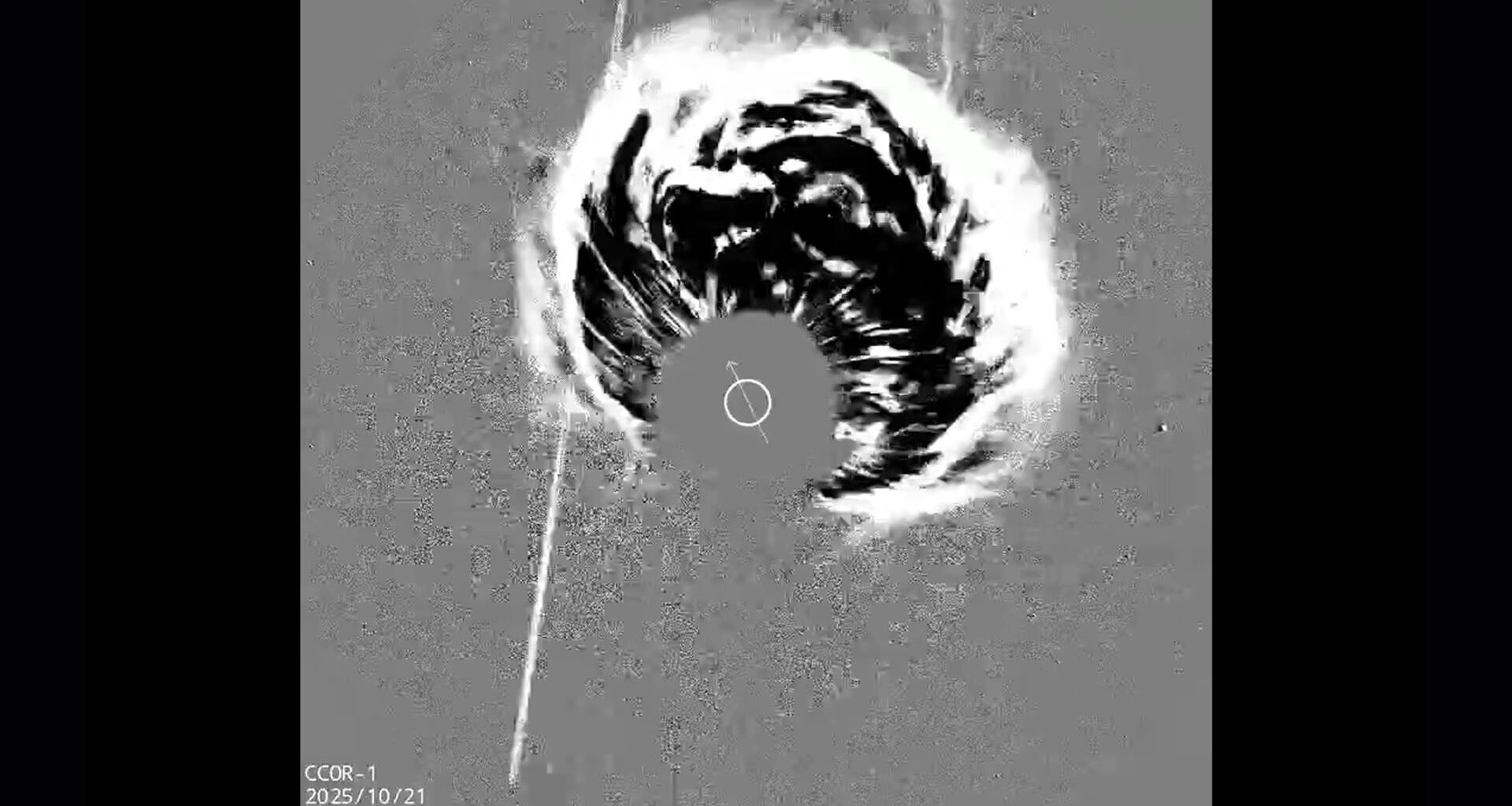A gray scale image shows a plume of energy coming from the center of the image