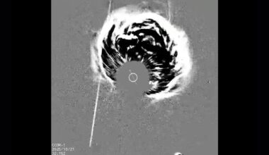 A gray scale image shows a plume of energy coming from the center of the image