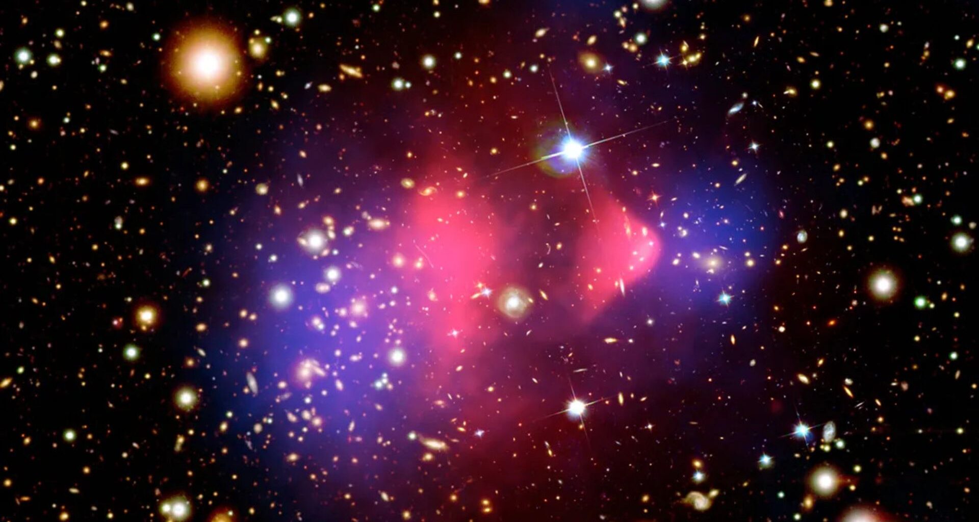 A series of blue and red blurs of light swirl around stars in a deep space image