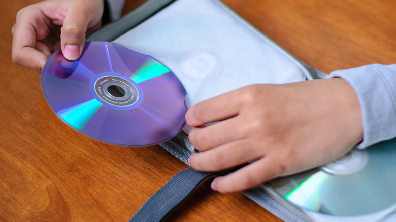 A person organizing DVDs