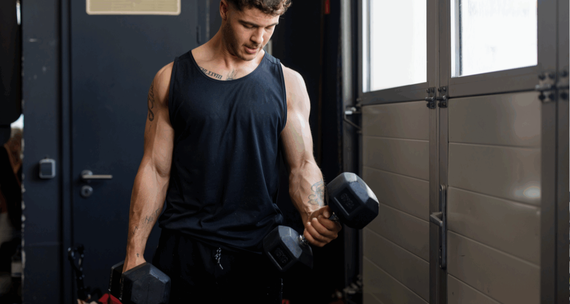 A man performing dumbbell bicep curls