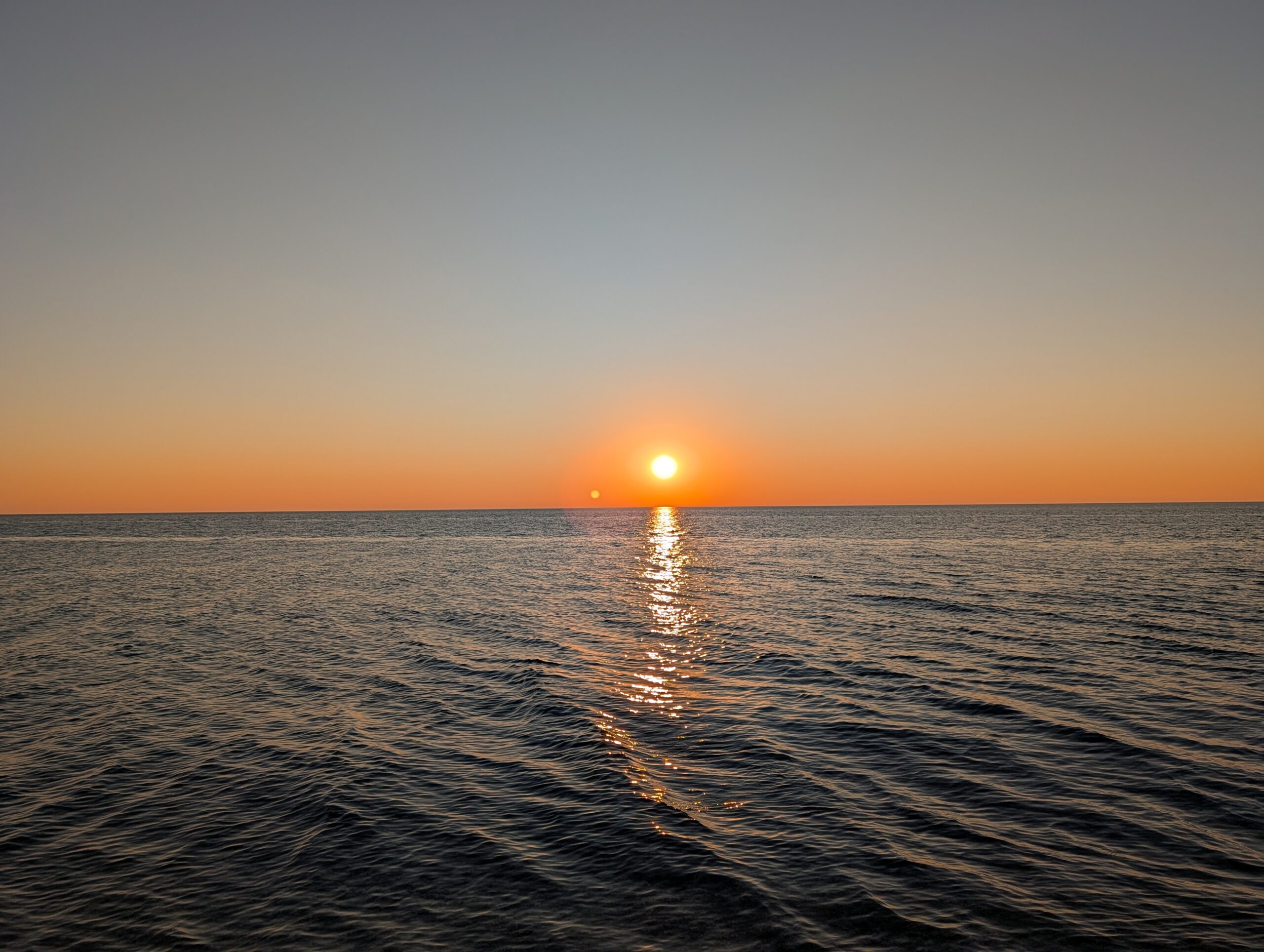 Picture of a sunset over a lake, taken with the Pixel 10 Pro.
