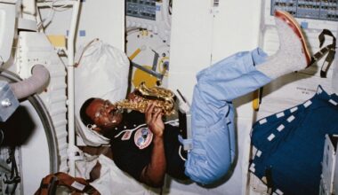 Astronaut plays a soprano saxophone while floating in the middeck of the Space Shuttle Challenger during STS-41B.
