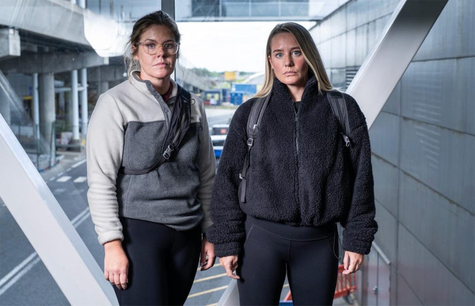 two individuals wearing casual outerwear in an urban environment