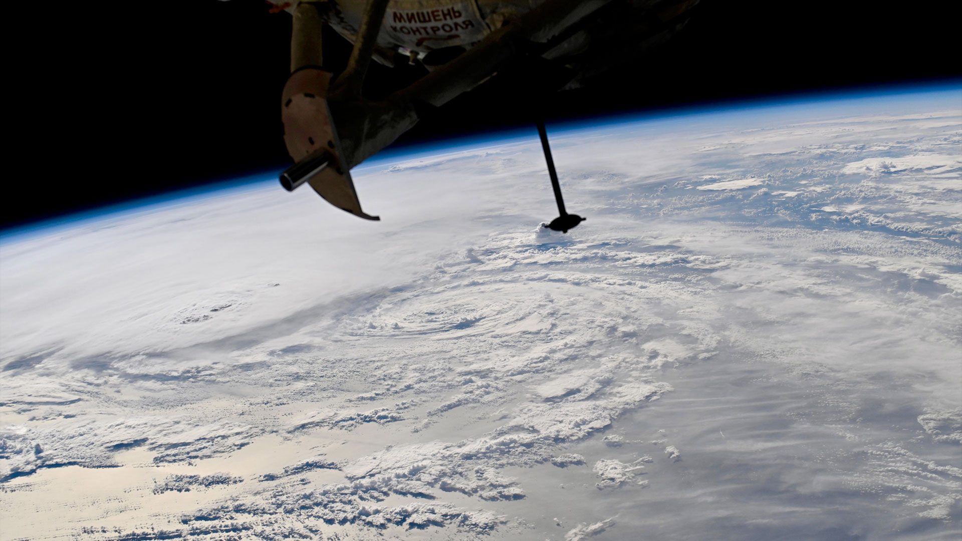 a radial cloud formation is seen on Earth from above on a space station