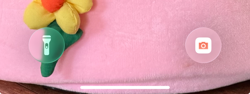 iOS 26 lock screen with the Manual camera app in place of Apple Camera.