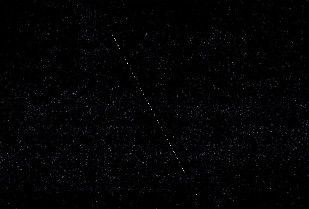 Starlink Satellites Under The Starry Night Sky