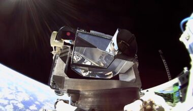 A metal module containing a laser operating on a satellite in low-Earth orbit.