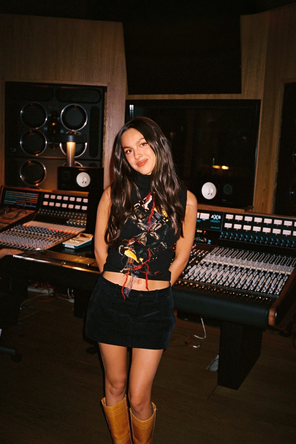 olivia rodrigo standing in a music studio