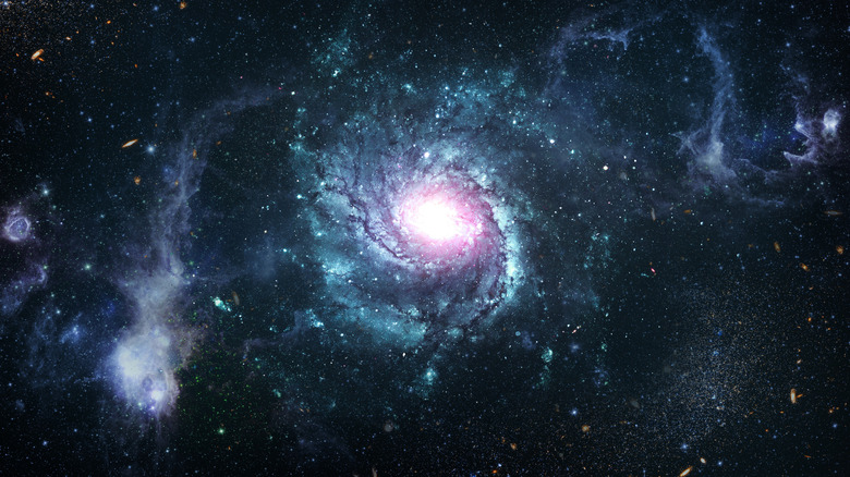 a galaxy with a spiral, stars, and solar systems