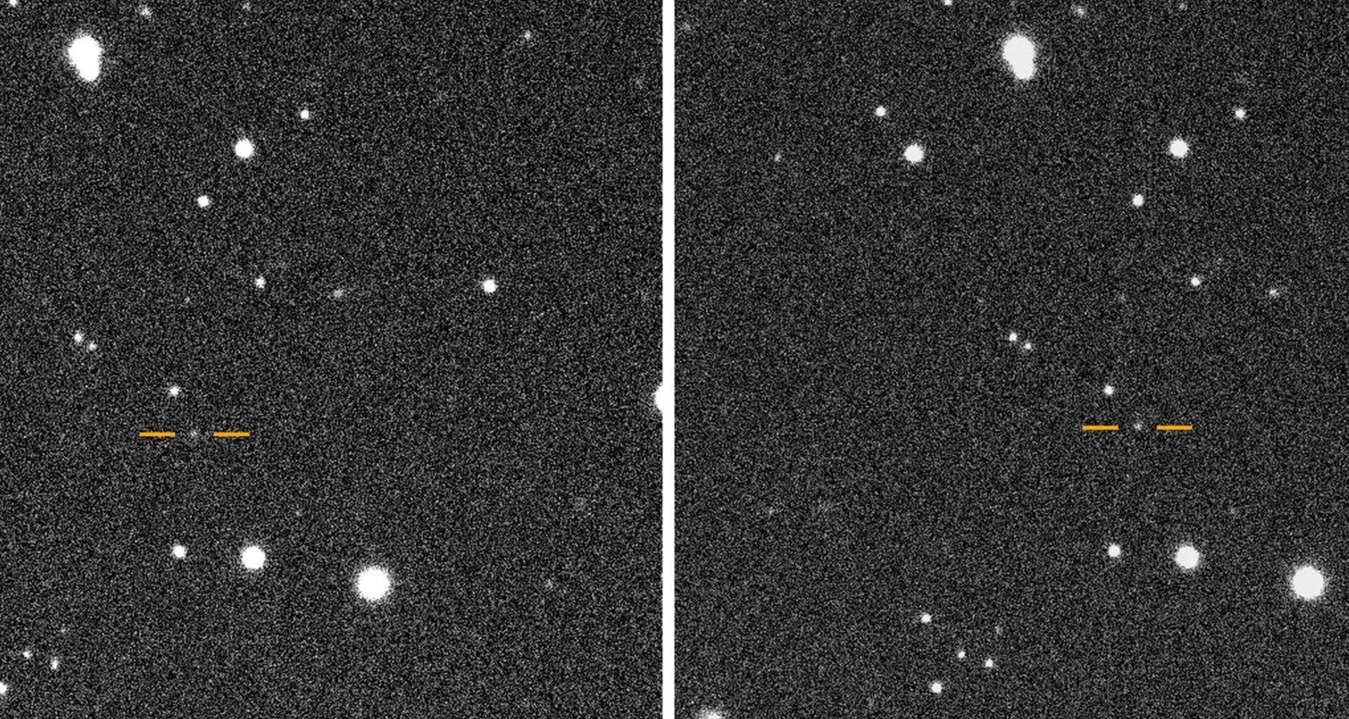 a white blurry dot on a black starry background