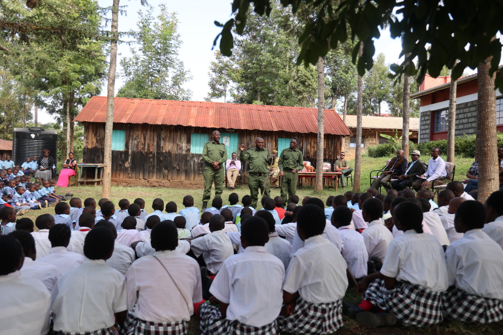 Kenyan rangers delivering an educational talk to schoolchildren.